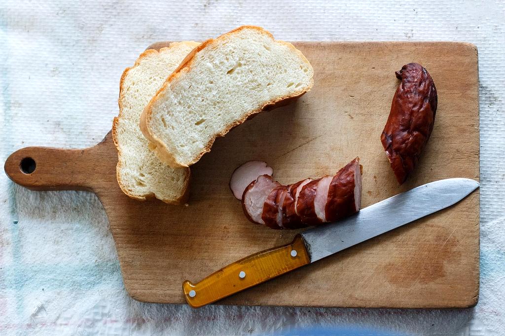 Hands holding a smartphone showing nutrition app with personalized data